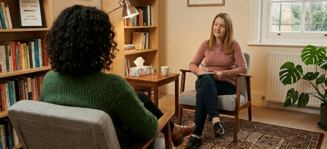Therapist speaking with a patient during counseling session